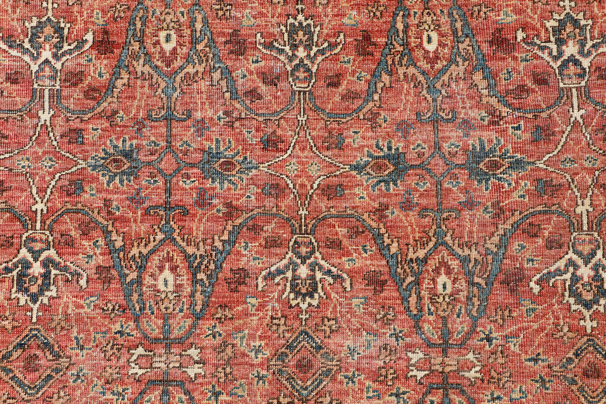 A hand-knotted antique-style 6x8 wool rug.