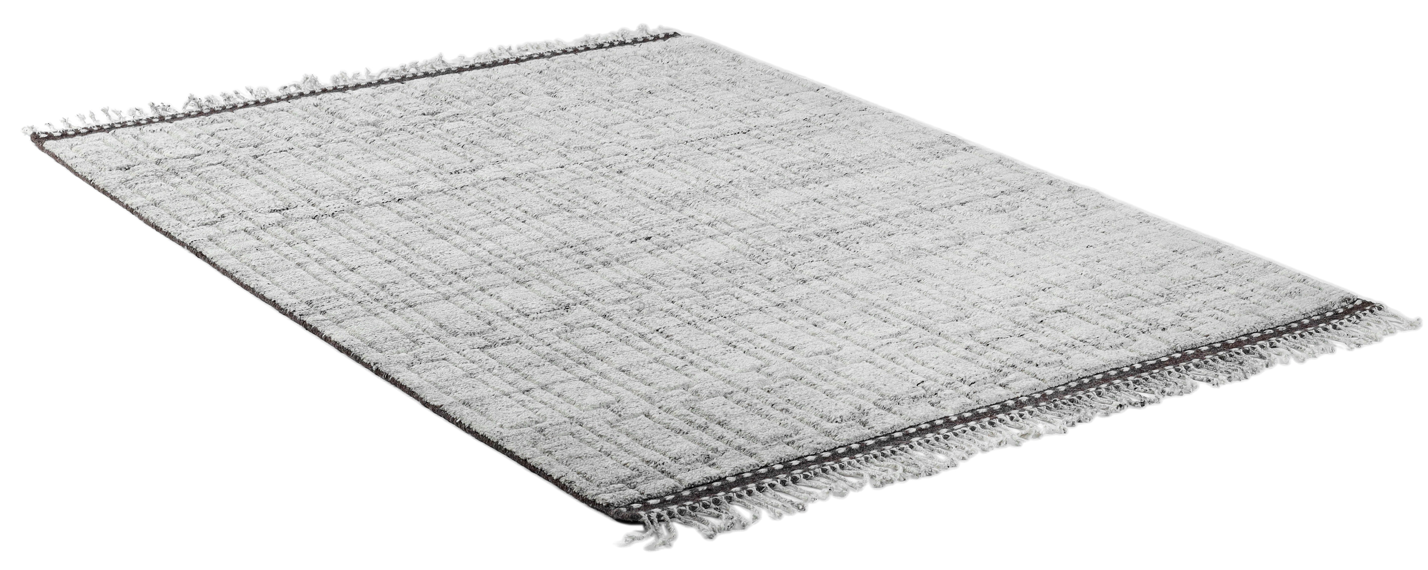 A hand-knotted modern wool rug in a neutral grey colour combination.