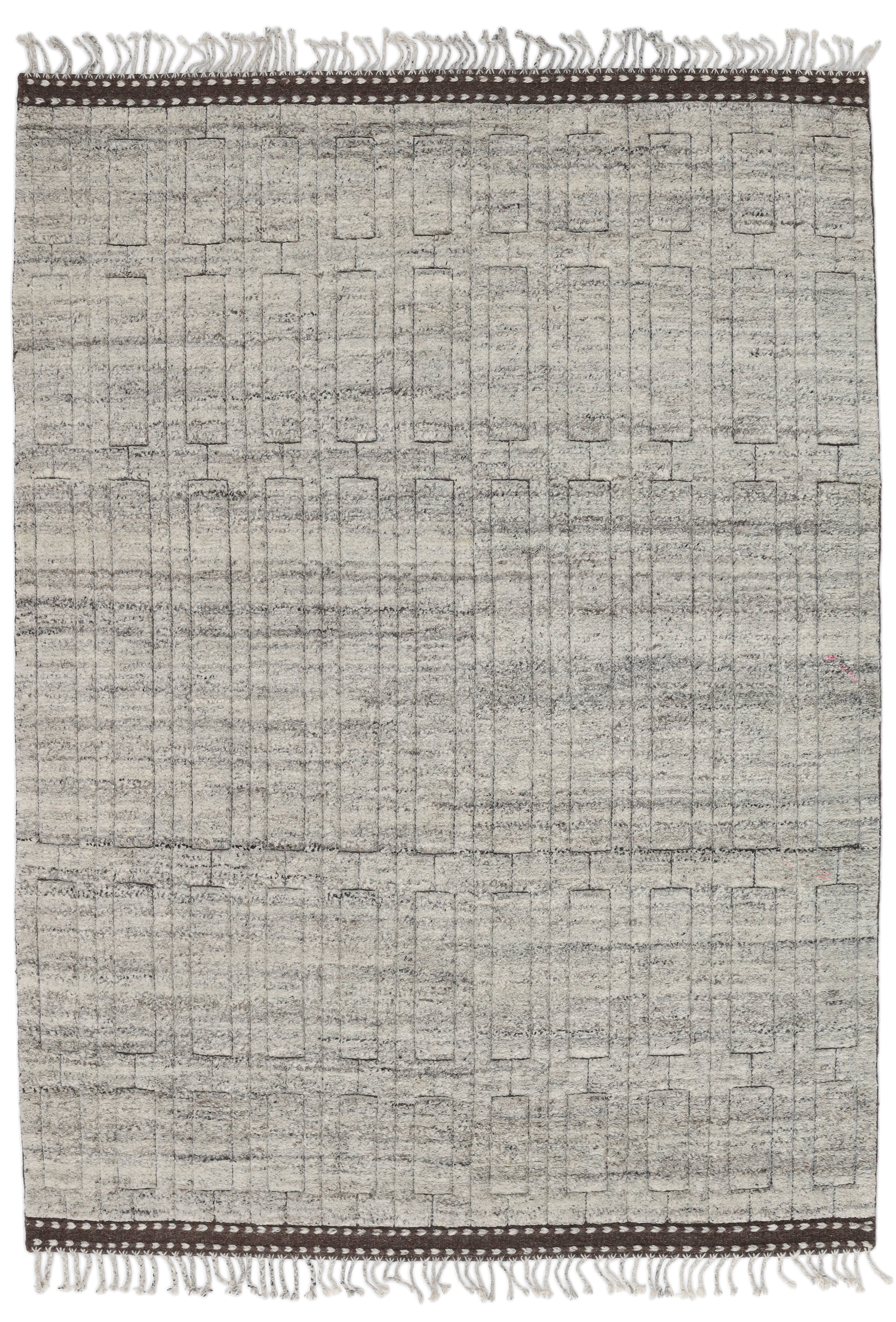 A hand-knotted modern wool rug in a neutral grey colour combination.