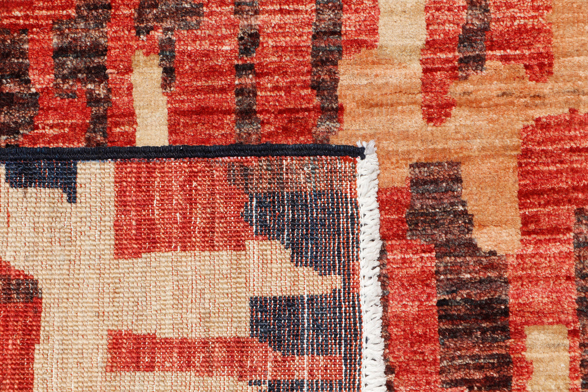 A hand-knotted runner rug featuring a contemporary design.