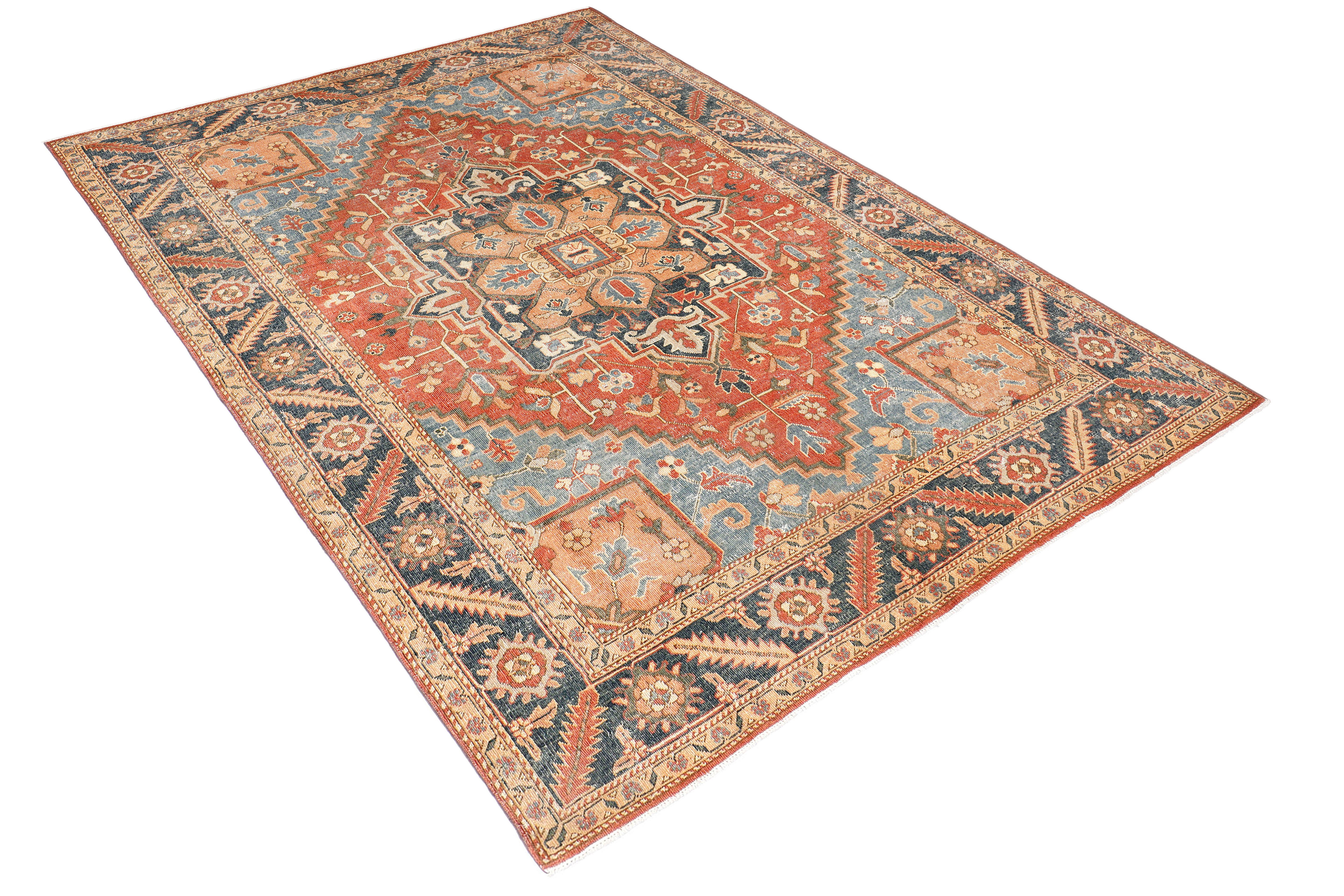 A hand-knotted antique-style wool rug featuring a classic Serapi design.