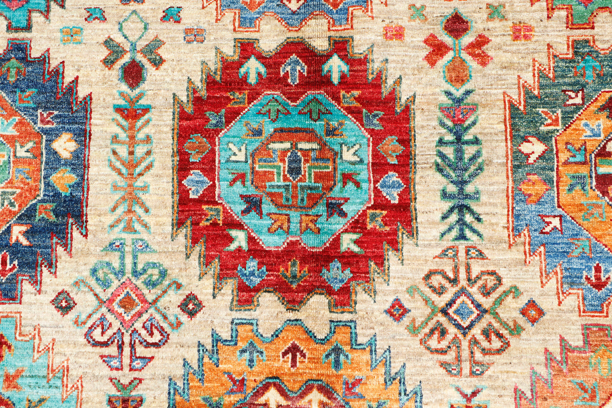 A hand-knotted 7x10 wool rug featuring a contemporary Ersari design.