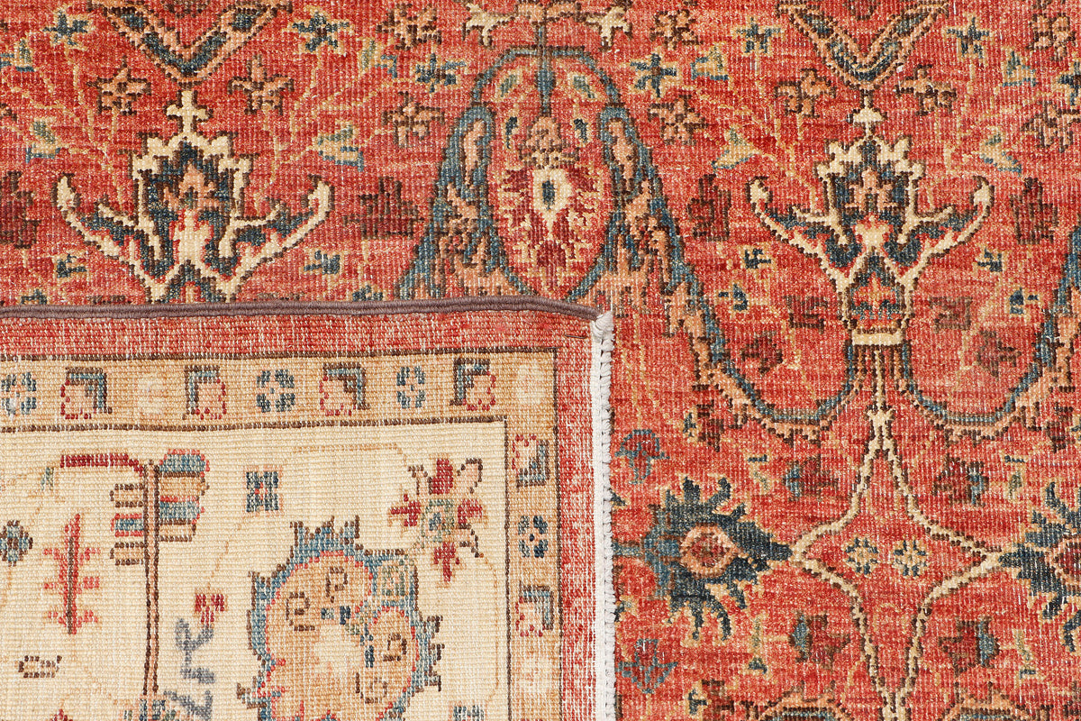 A hand-knotted antique-style 6x8 wool rug.
