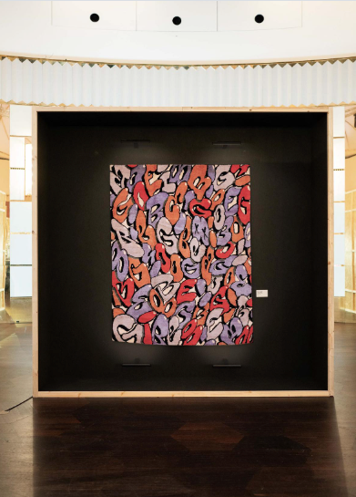 A hand-knotted custom rug by Boogie and Kasra Rugs on display at an exhibit in Switzerland.