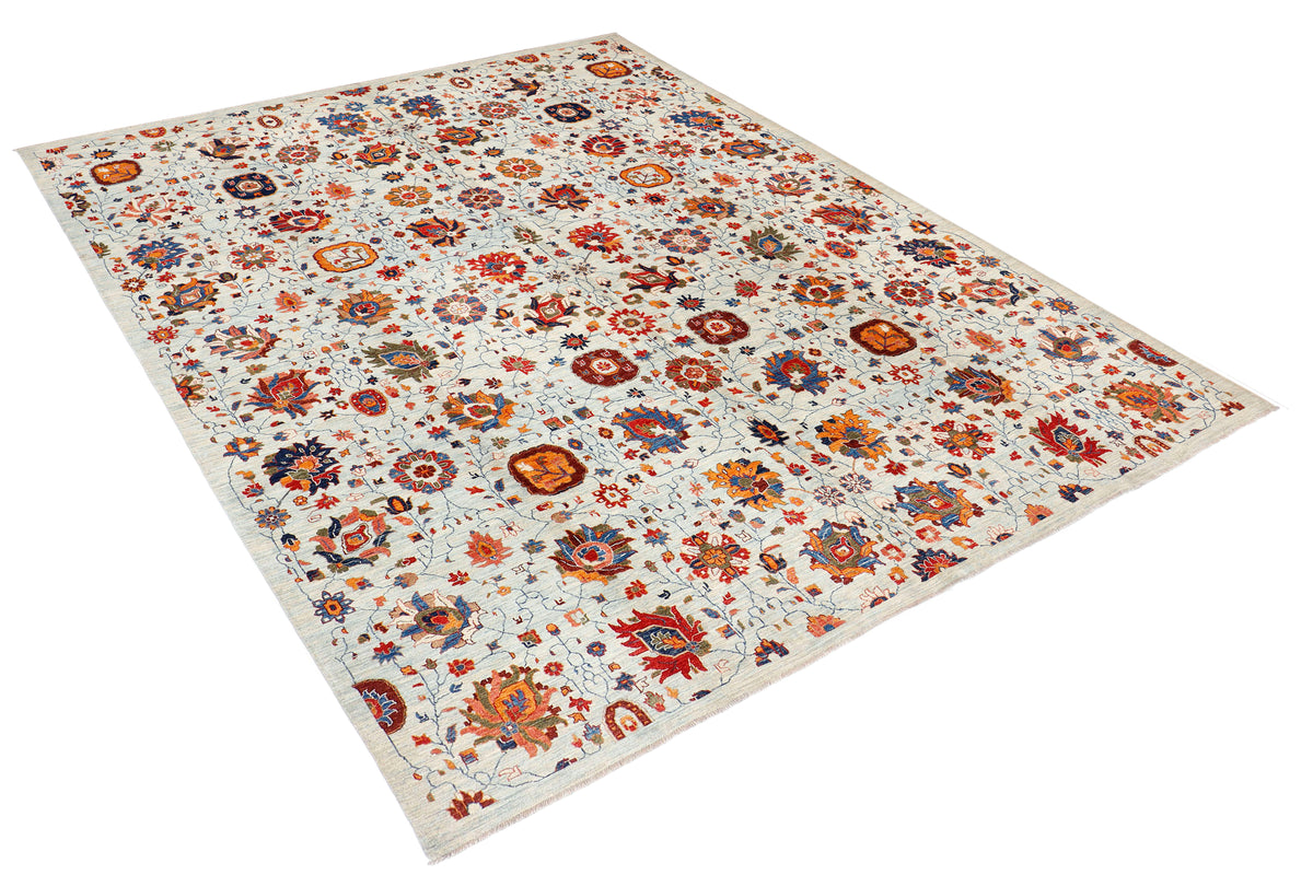 A handmade 10x12 wool rug featuring an all-over floral pattern.