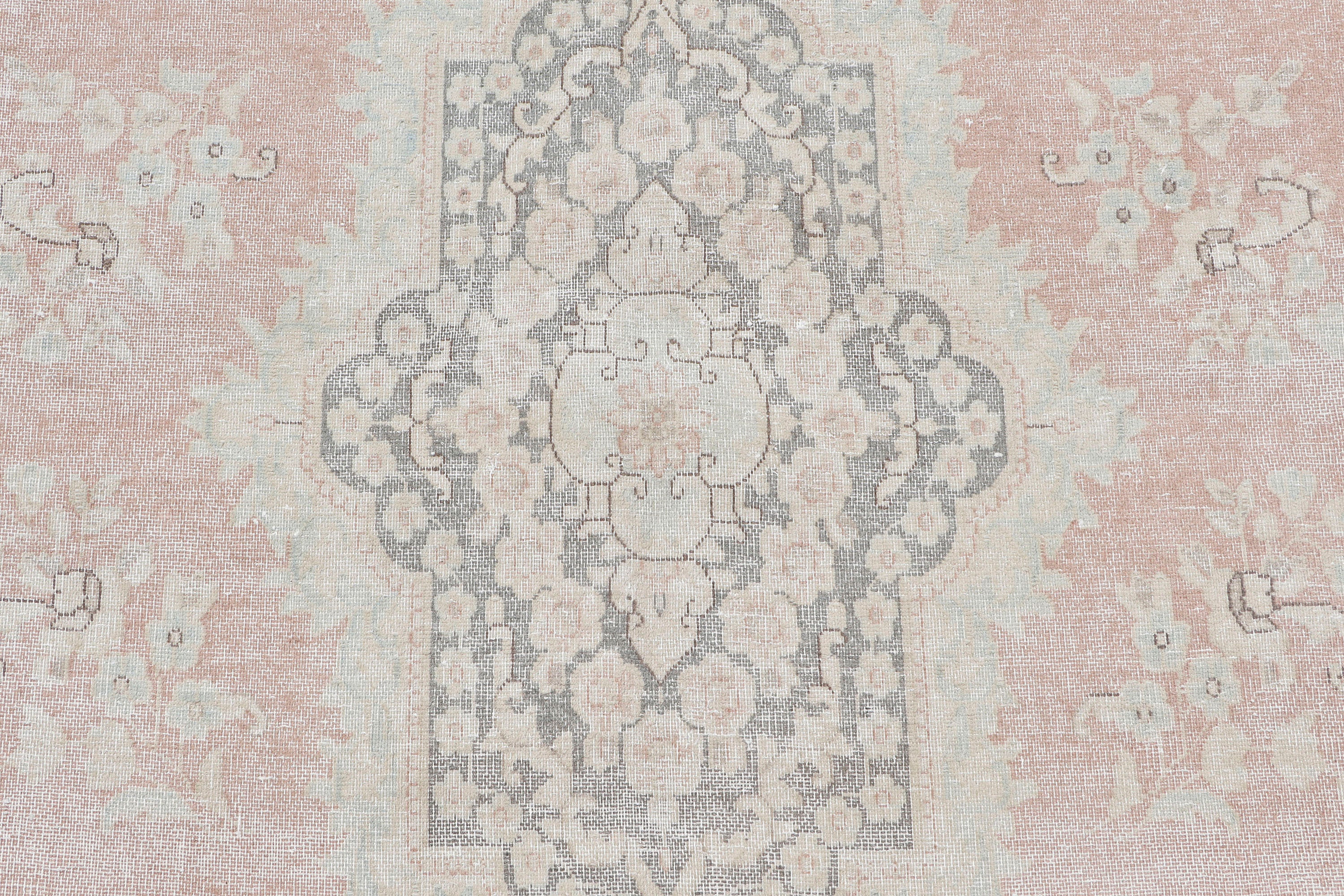 A hand-knotted 10x13 vintage wool rug featuring a blush colour combination.