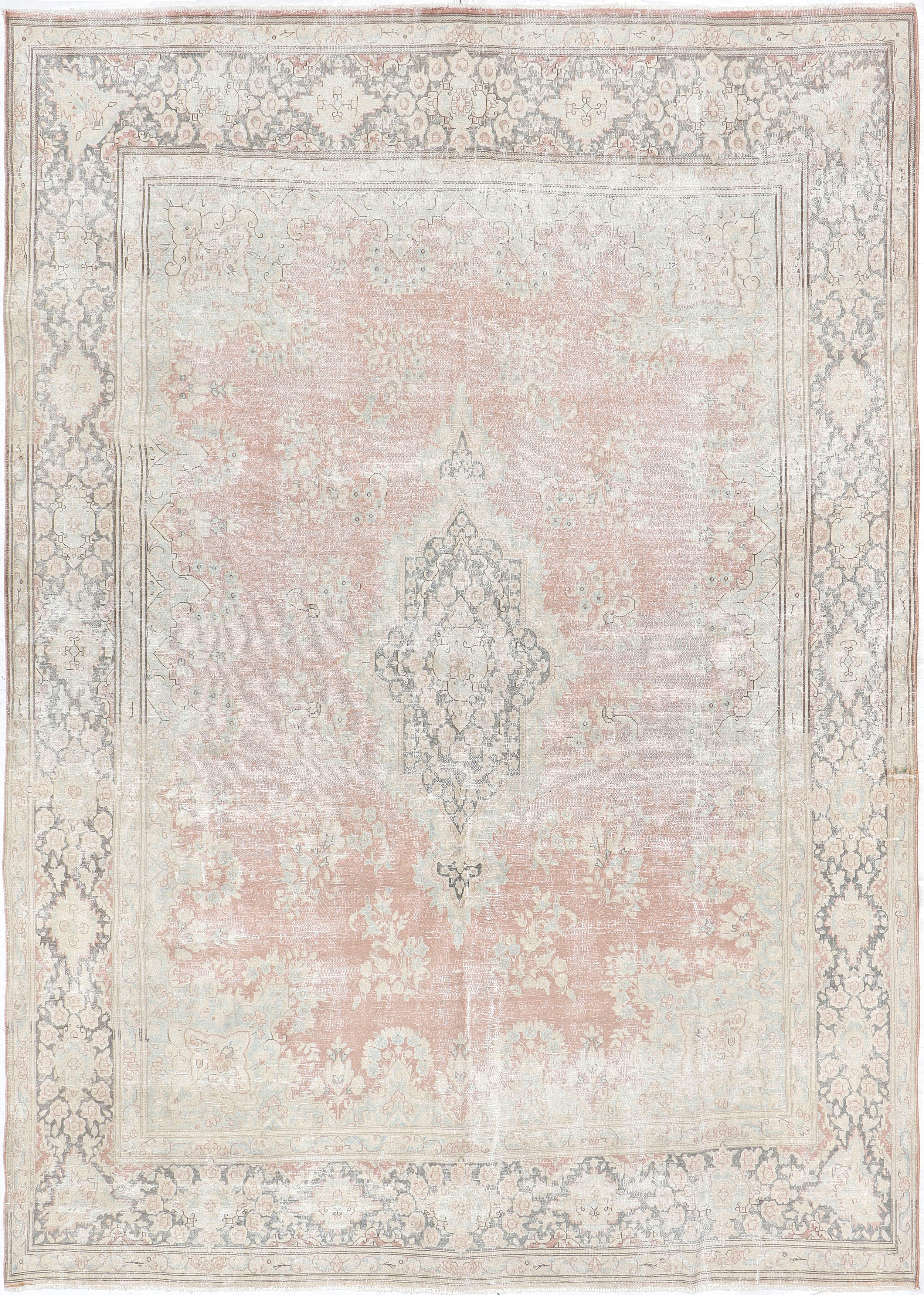 A hand-knotted 10x13 vintage wool rug featuring a blush colour combination.