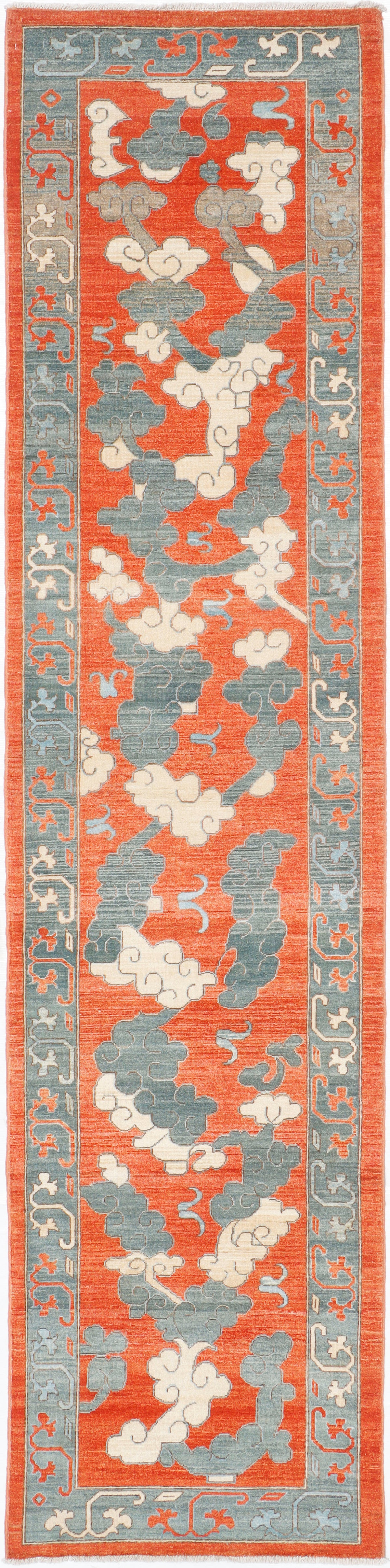 A handmade wool runner rug featuring a contemporary design.