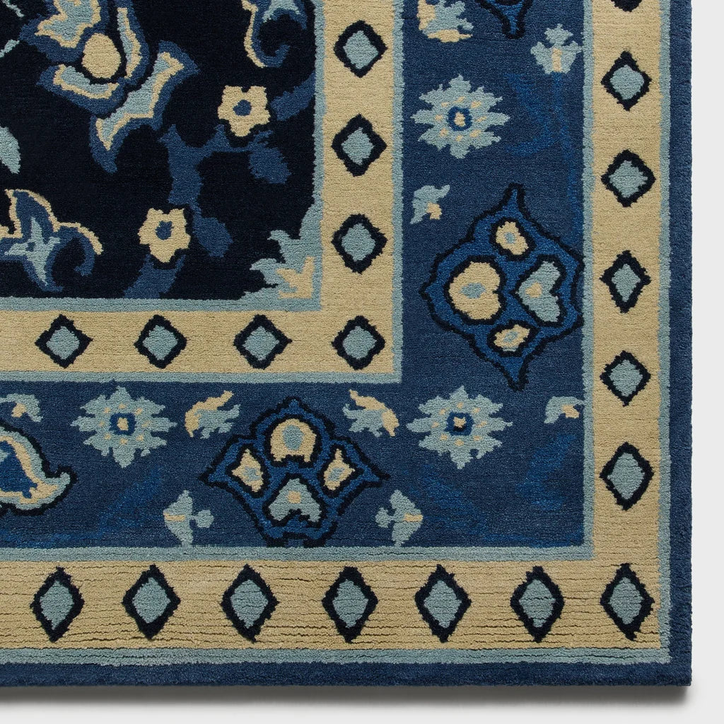 A hand-knotted Yankees rug by Kasra Rugs x Kith in a blue colour combination.