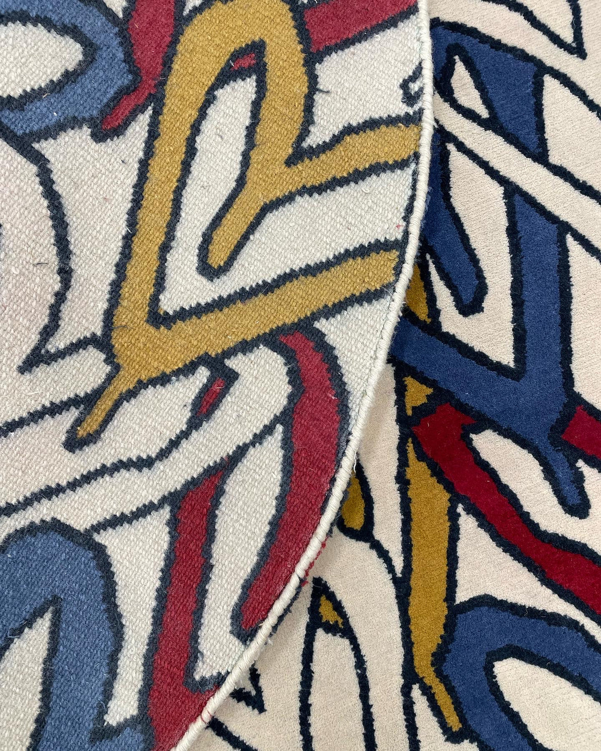 A hand-knotted custom rug made in collaboration with Ricciardi Paints and Kasra Rugs.