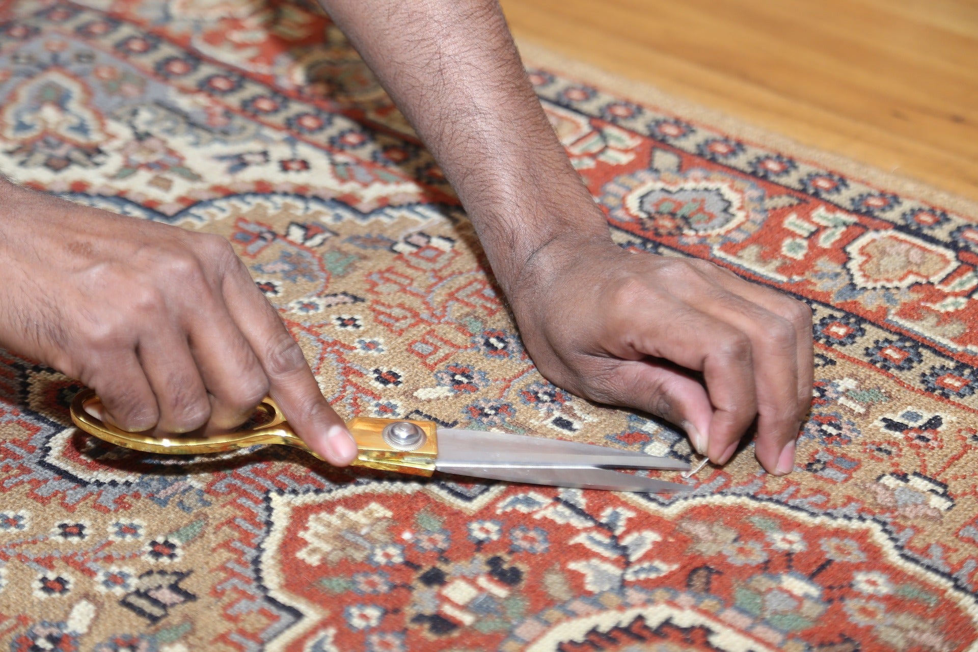 A skilled repairman working on a rug repair in Toronto.