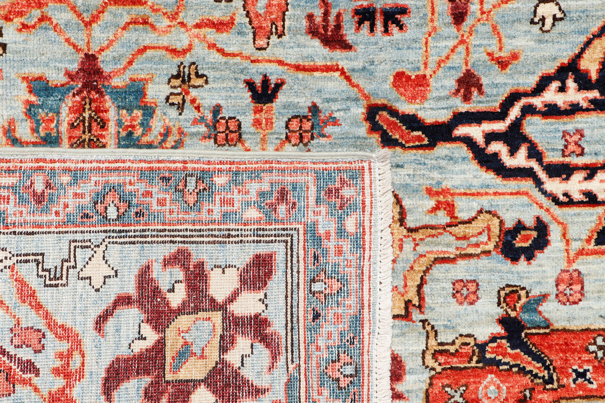A hand-knotted 8x11 wool rug featuring a classic tribal design in a contemporary colour combination.